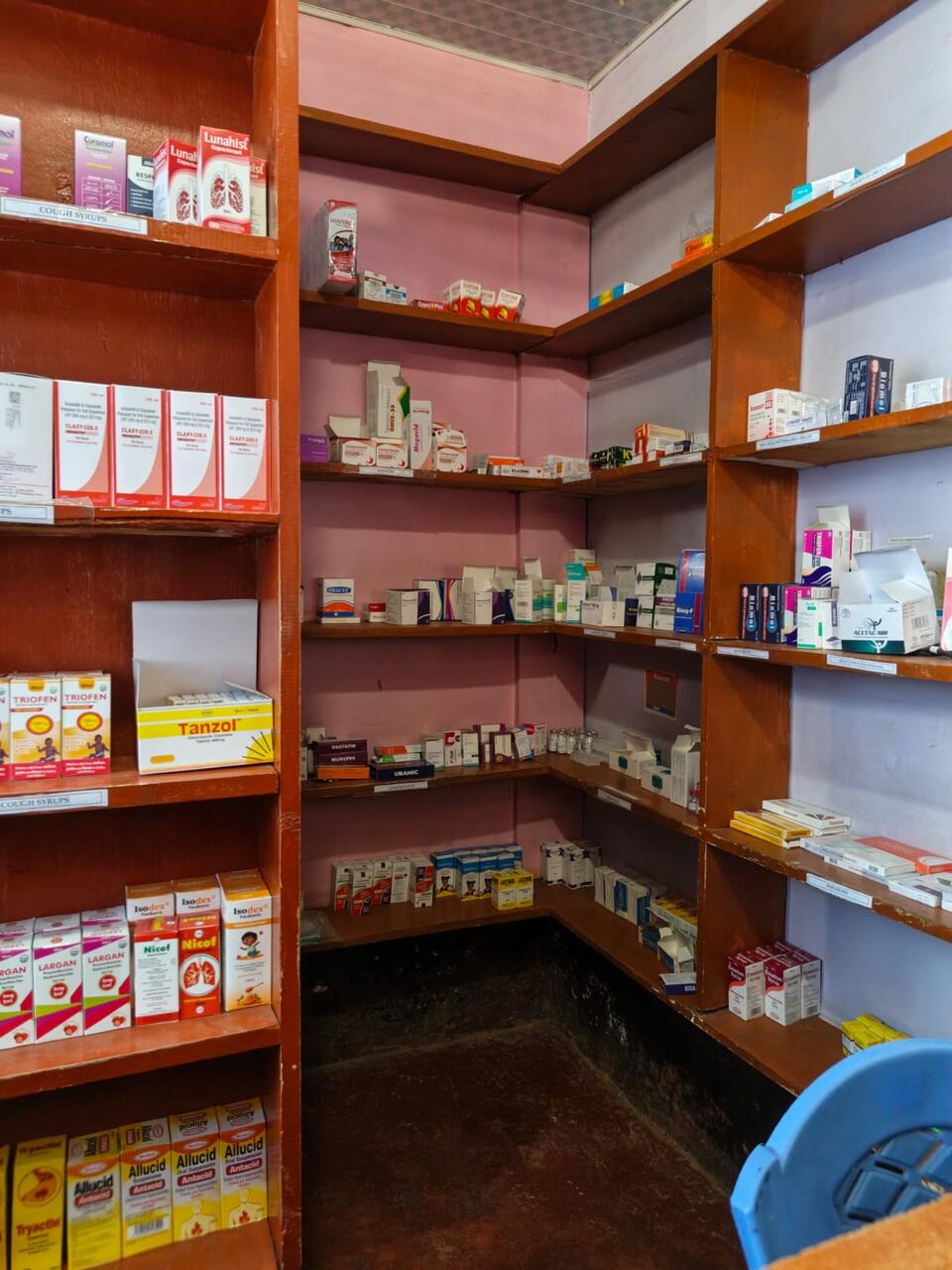 Corner of the Primegala pharmacy store, with medicines arranged on labelled shelves